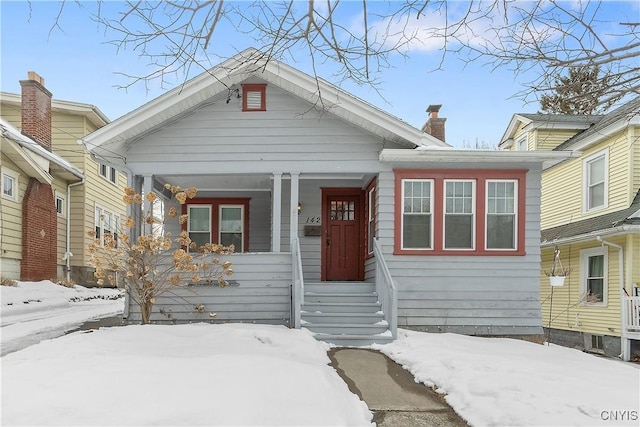 bungalow-style house with a chimney