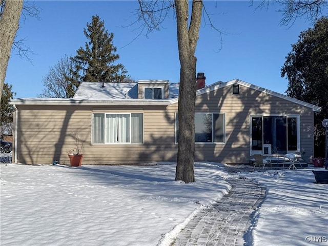 view of snow covered house