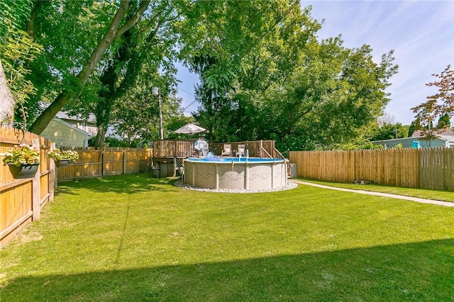 view of yard with a fenced backyard and a fenced in pool