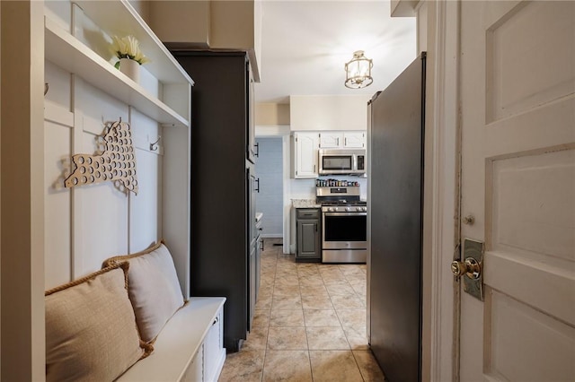 mudroom with light tile patterned floors