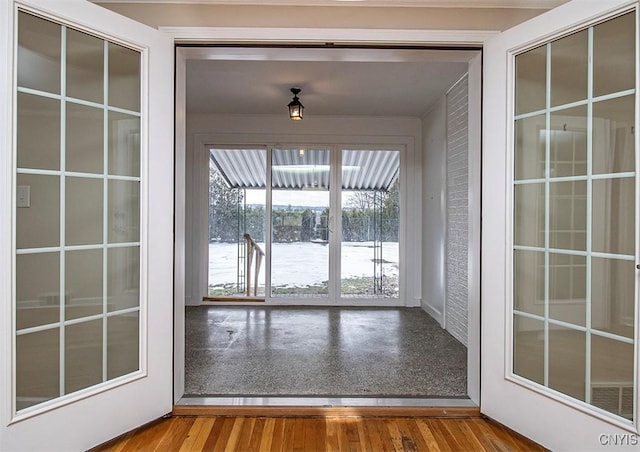 doorway to outside with wood finished floors