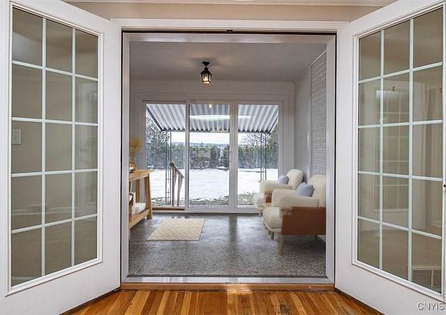 doorway to outside with wood finished floors