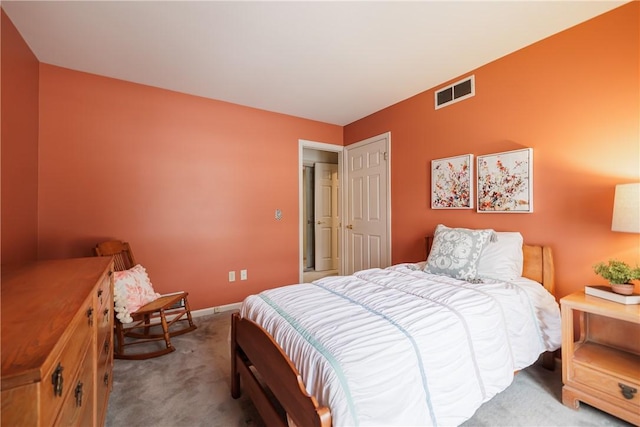 bedroom with carpet floors, baseboards, and visible vents