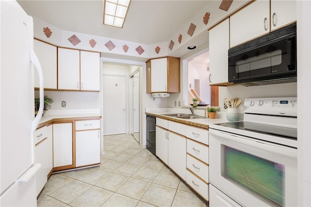 kitchen featuring light countertops, black appliances, white cabinetry, a sink, and light tile patterned flooring