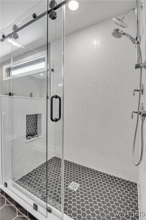 bathroom featuring a shower stall