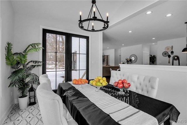 dining space with a chandelier, baseboards, and recessed lighting