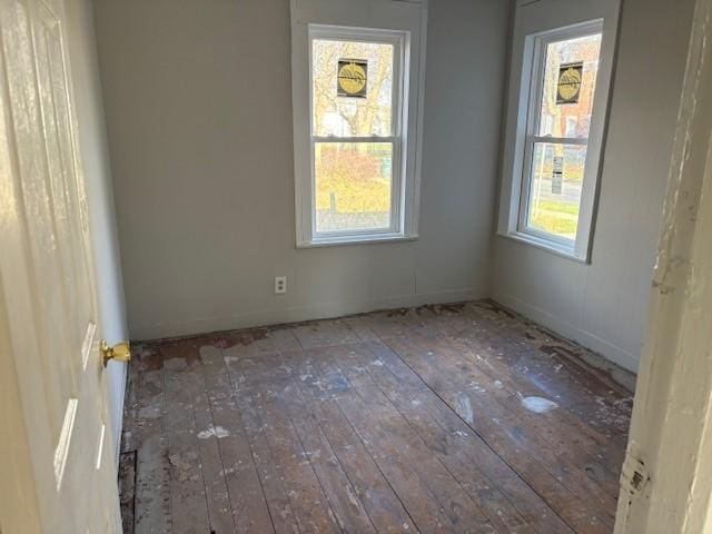 unfurnished room featuring hardwood / wood-style floors