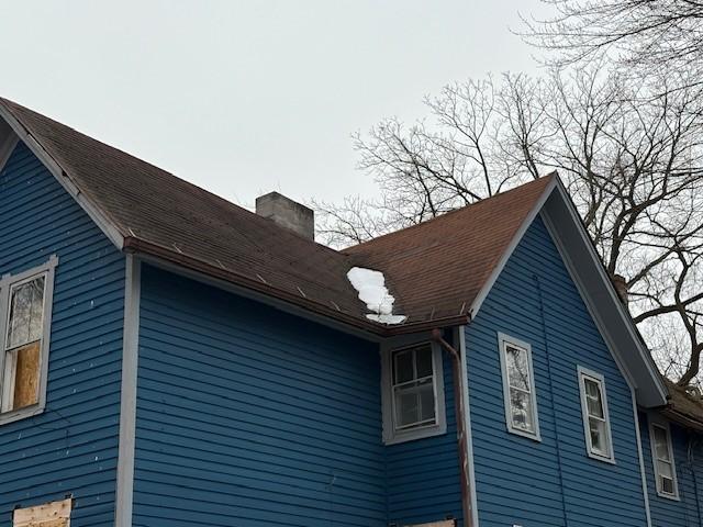 view of home's exterior featuring a chimney