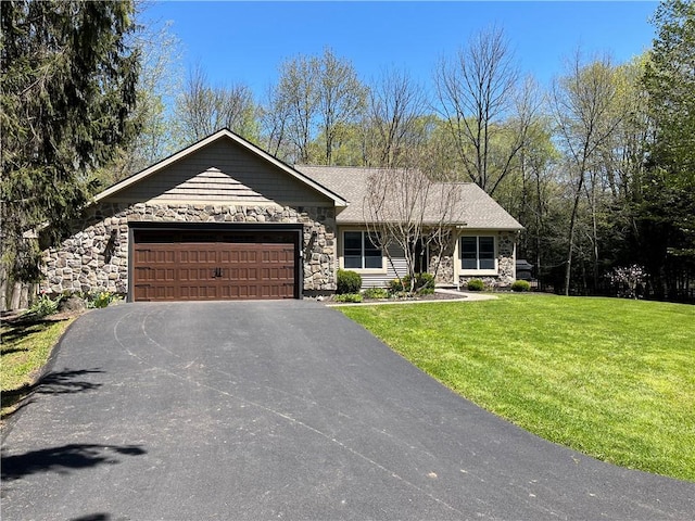 ranch-style home with driveway, stone siding, an attached garage, and a front lawn