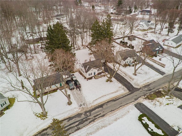 snowy aerial view featuring a residential view