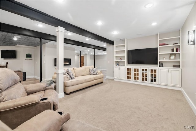 living room with recessed lighting, baseboards, and light colored carpet