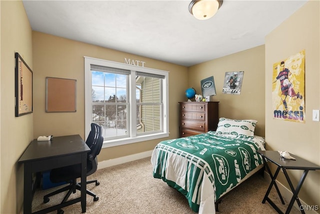 bedroom with baseboards and carpet flooring