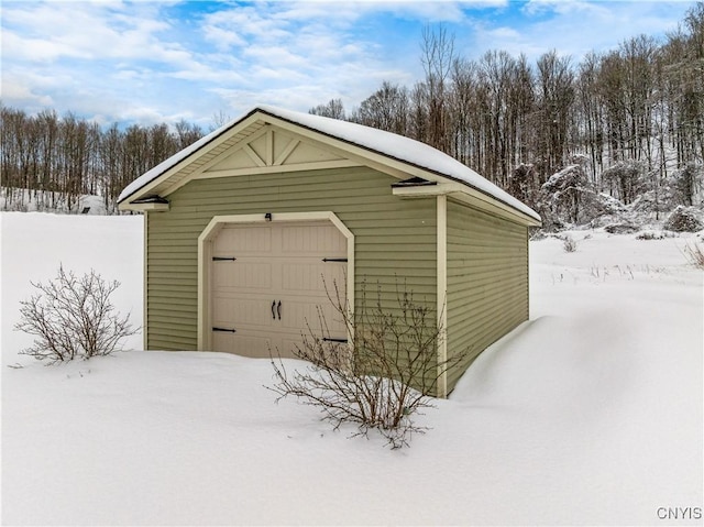 view of snow covered garage