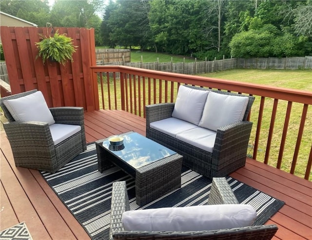 wooden terrace with a yard, outdoor lounge area, and a fenced backyard