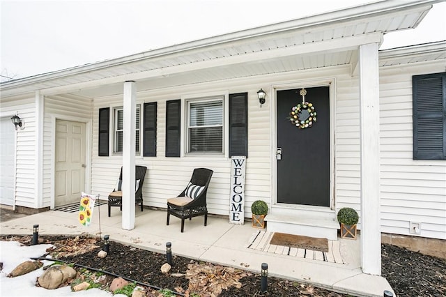 doorway to property with covered porch