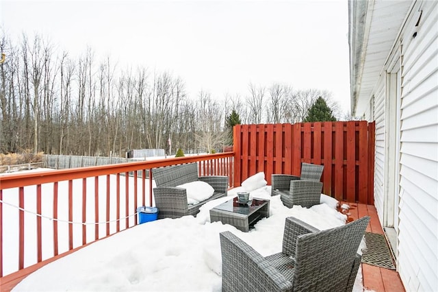 deck with outdoor lounge area and fence