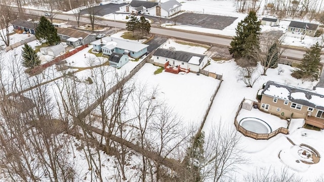 snowy aerial view featuring a residential view