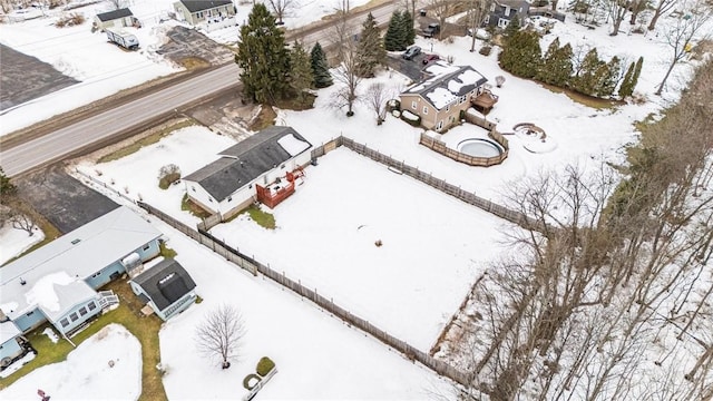 snowy aerial view featuring a residential view