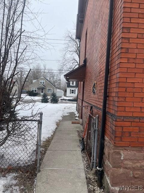 view of property exterior with brick siding