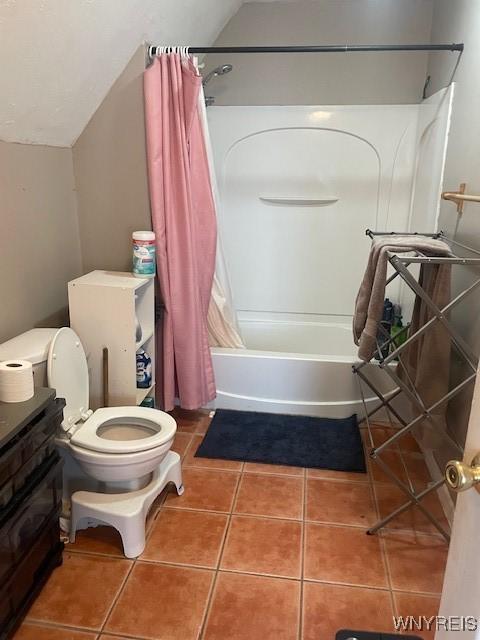 full bathroom with toilet, tile patterned flooring, shower / bath combo, and lofted ceiling