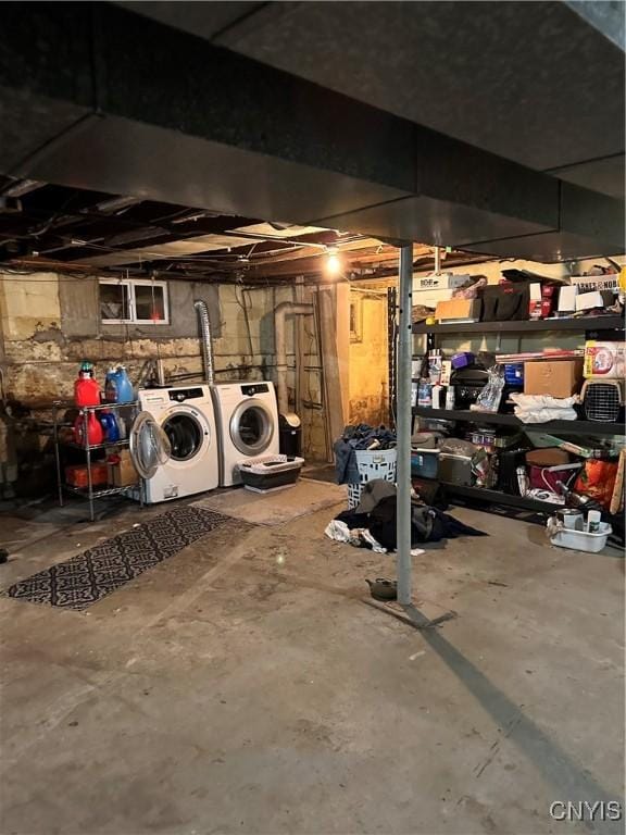 unfinished basement with washing machine and dryer