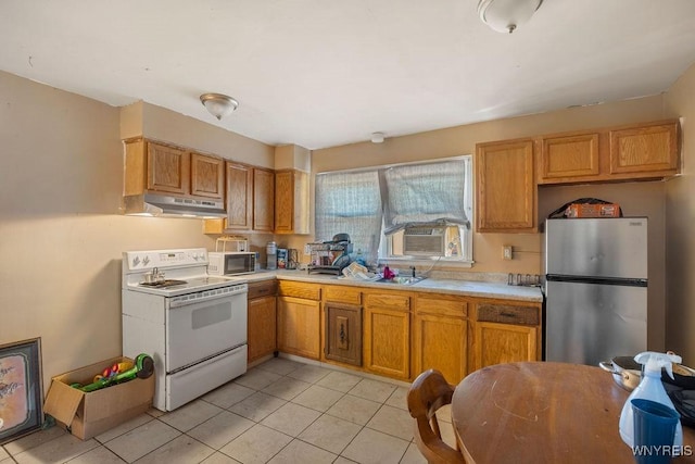 kitchen featuring cooling unit, under cabinet range hood, light countertops, white range with electric stovetop, and freestanding refrigerator