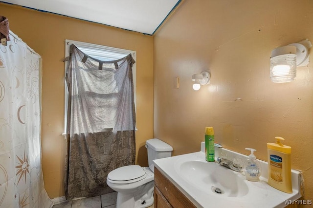 bathroom with toilet, tile patterned floors, a shower with curtain, and vanity