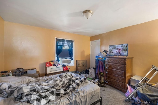 bedroom featuring carpet floors and cooling unit