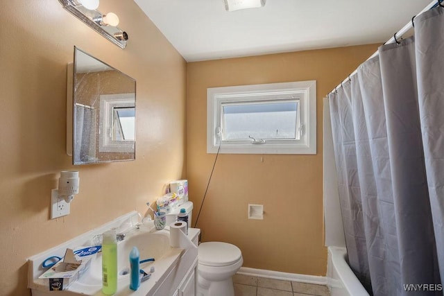 bathroom featuring shower / tub combo with curtain, toilet, vanity, tile patterned flooring, and baseboards