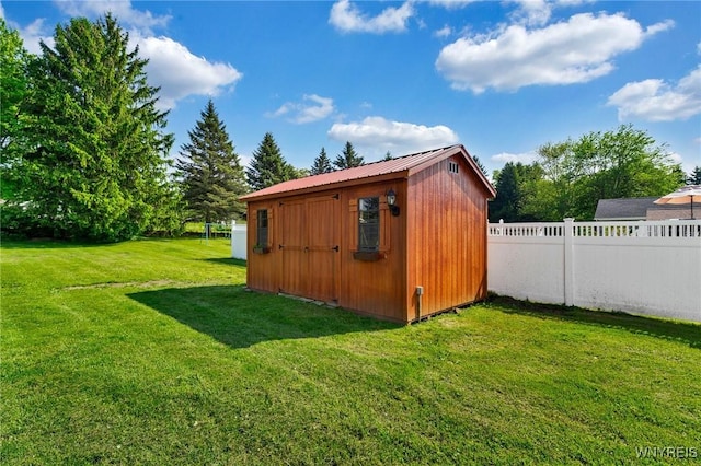 view of shed featuring a fenced backyard