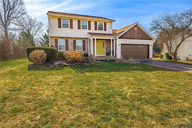 view of front of property featuring aphalt driveway, a garage, and a front yard