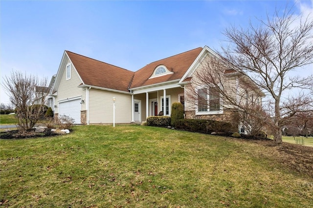 view of front of house with a front yard and an attached garage