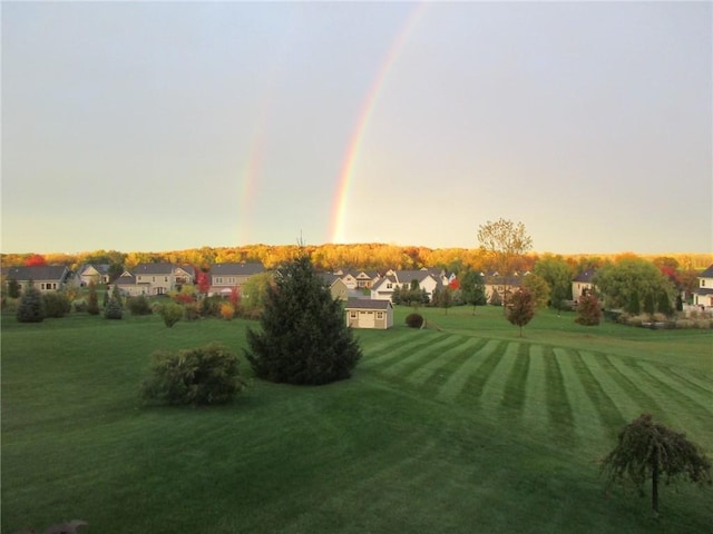 yard at dusk with a residential view