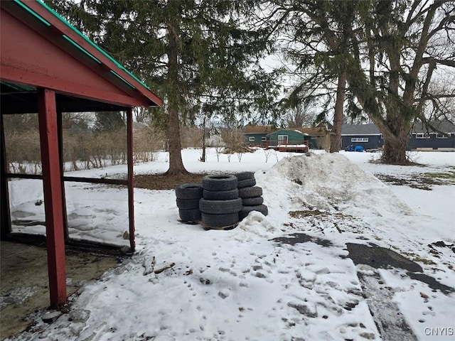 view of yard covered in snow