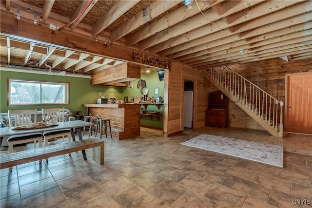 interior space featuring wooden walls