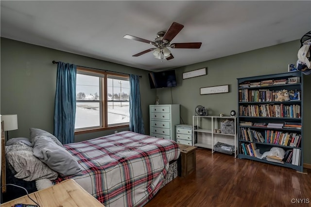 bedroom featuring a ceiling fan and wood finished floors