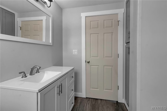 bathroom featuring wood finished floors and vanity