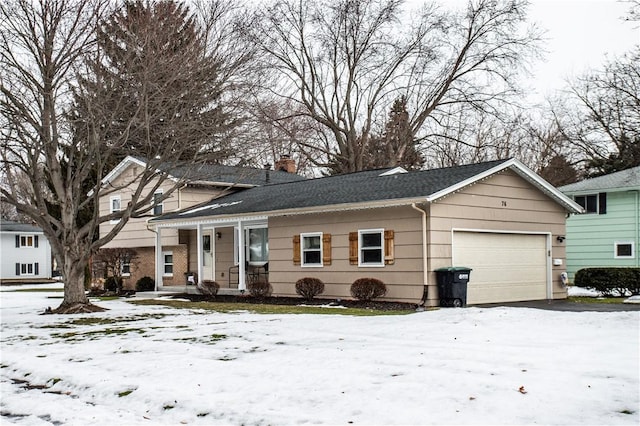 tri-level home featuring an attached garage, a chimney, a porch, and roof with shingles