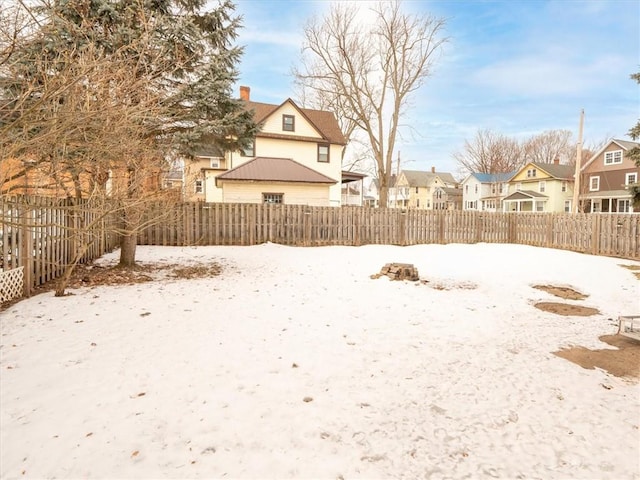 view of yard with a fenced backyard and a residential view