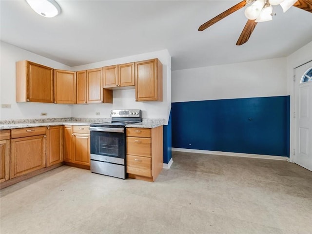 kitchen with baseboards, ceiling fan, and stainless steel range with electric cooktop