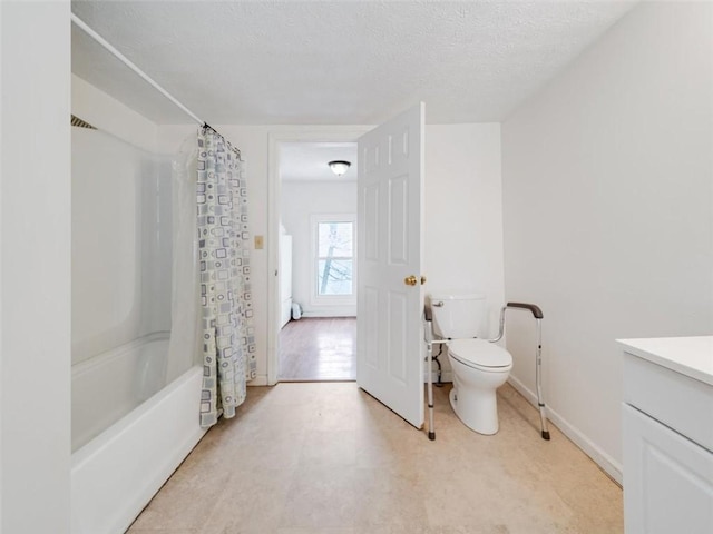 bathroom featuring a textured ceiling, toilet, vanity, baseboards, and shower / bath combo with shower curtain