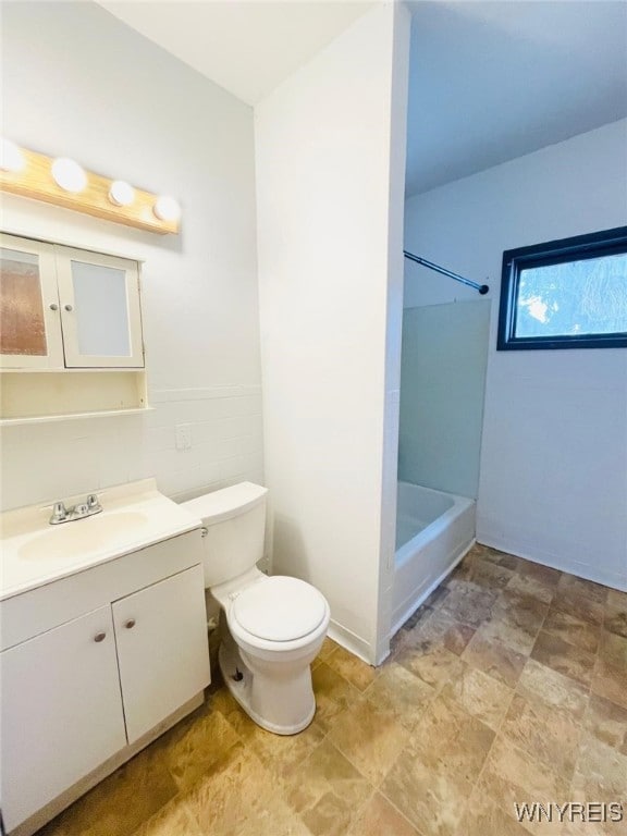 full bathroom with toilet, tub / shower combination, and vanity