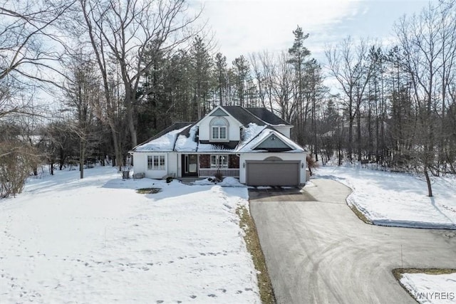 view of front of home featuring a garage and aphalt driveway