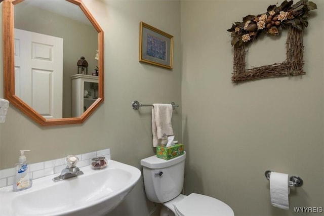 bathroom with a sink and toilet