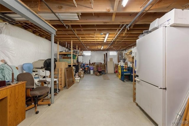 basement with freestanding refrigerator