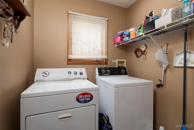 washroom featuring laundry area and separate washer and dryer