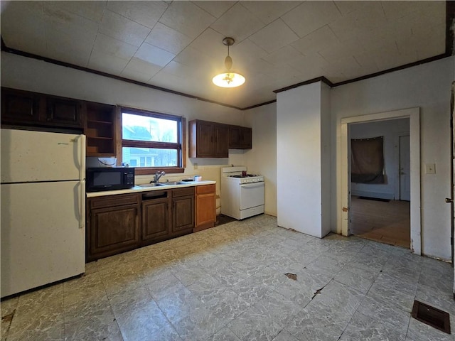 kitchen with white appliances, a sink, light countertops, dark brown cabinets, and crown molding