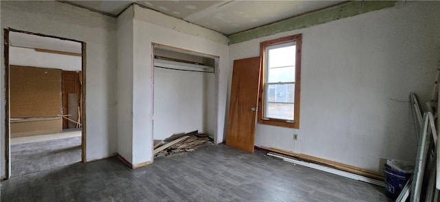 unfurnished bedroom with a closet and wood finished floors