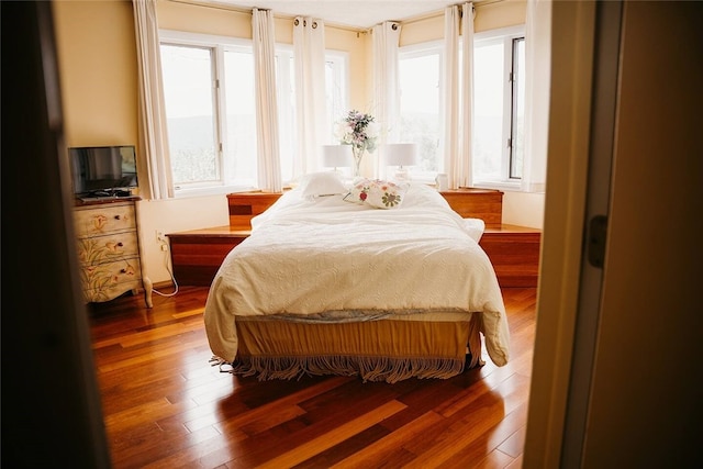 bedroom featuring wood finished floors