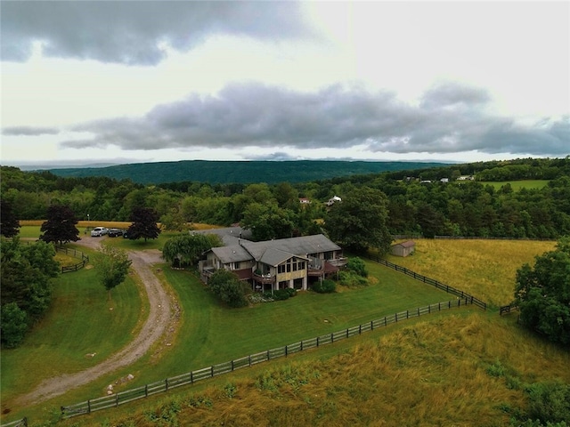 bird's eye view featuring a forest view and a rural view